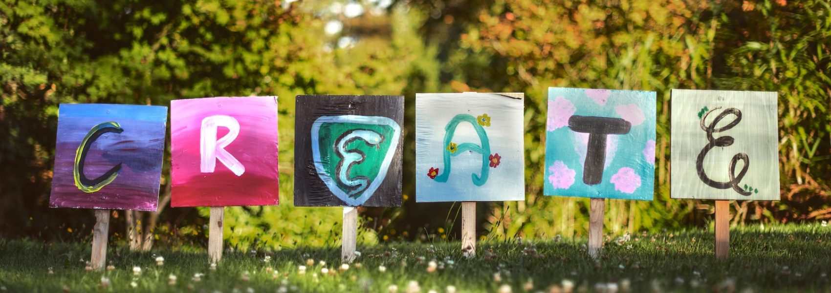 selective focus photo of create signage